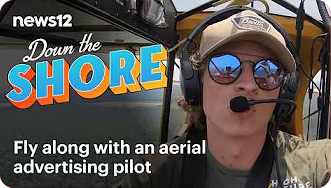 Fly along with an aerial advertising pilot